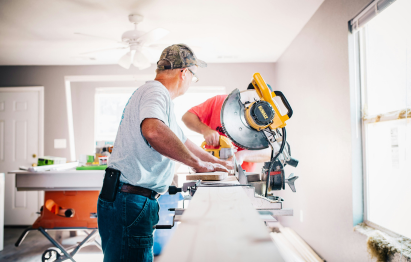 Picture of a man using a power tool.